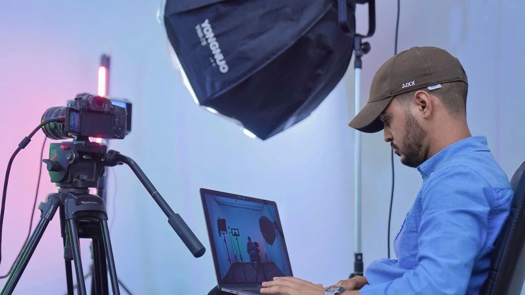 The four-person in-house retouching department with color-calibrated monitors